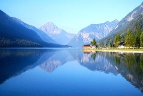 blue lake at the foot of the mountains