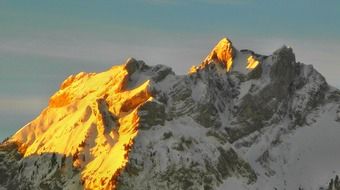 landscape of sunrise on the background of the snowy mountain peak