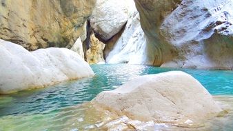 turquoise clear stream at white rocks in goynuk canyon, turkey, kemer