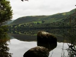 large stones in a quiet lake