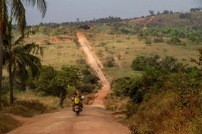 road in kenya safari scene with motocycle