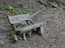 Old wooden bench on slope