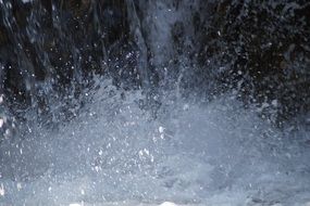 macro photo of splashing water from a waterfall