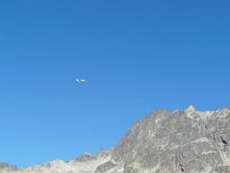 mountain sky and aircraft sunny scene