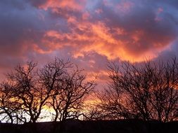 orange sunset in thunderclouds