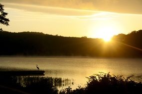 sunrise on the horizon over the lake