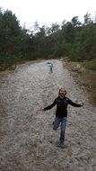 children on the road among the forest