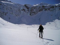 man on snowshoes in the mountains