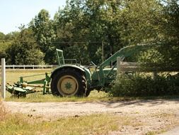 green tractor at farm