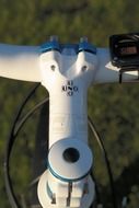 white metal handlebar of a mountain bike