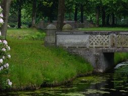 stone bridge over the river in the park