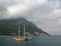 view from the sea on a yacht and an island in the mist