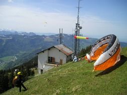 paraglider on start in mountain landscape