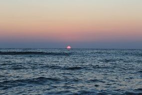 rising sun on the horizon of the ocean