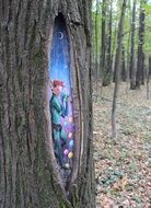 painting in a hollow tree