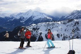 Skiing people on a beautiful mountains in snow