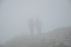 People outlines in fog