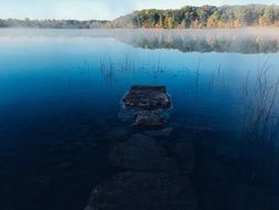 Stone in a clear lake