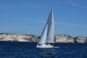 sailboat off the coast of corsica