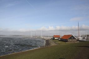 winter coastline with red roof buildings