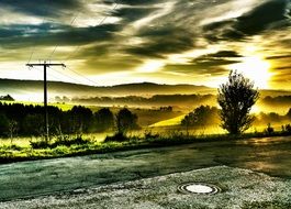 colorful sunrise over power lines