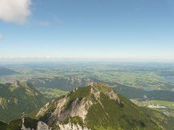 panoramic view of green mountains on a sunny day