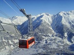 Cable car over the beautiful white snow-capped mountains