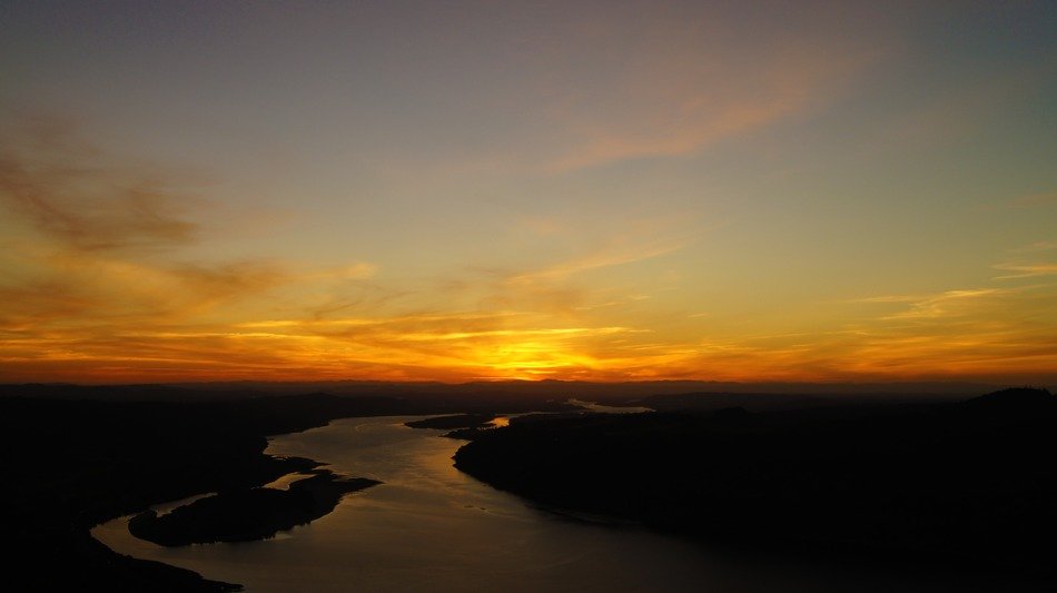 orange beautiful sunset over the river valley