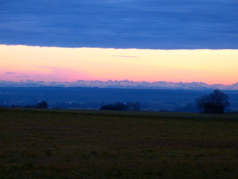 alpine mountains in the evening sky