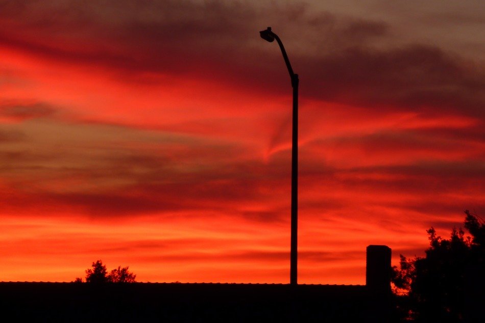 bright red sunset sky with clouds view