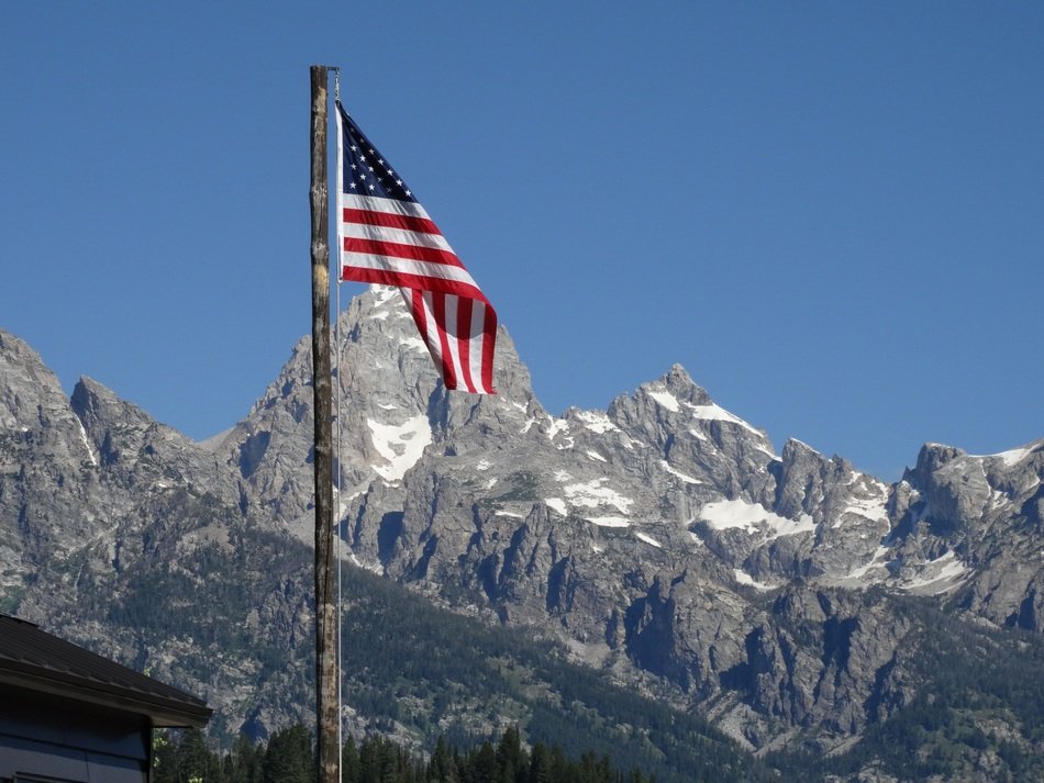 american flag in mountains