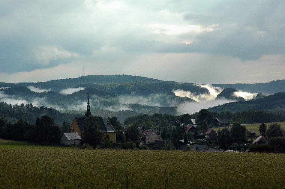 Fog in the beautiful mountains in beautiful cloudy weather, Germany, Hinterhermsdorf