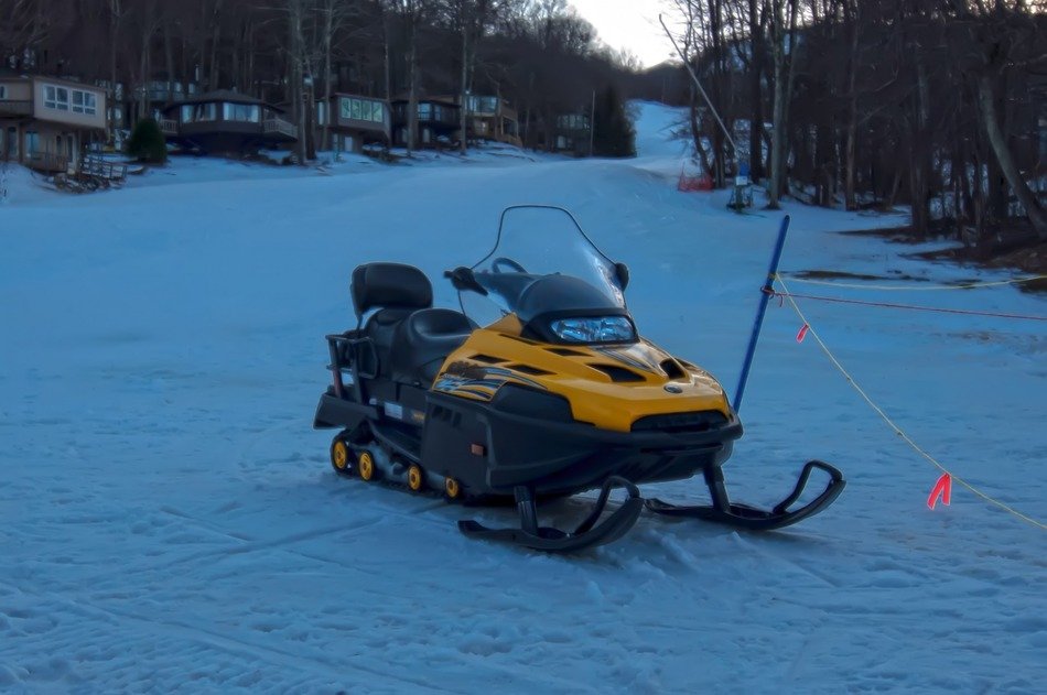 snowmobile for extreme relaxation in the mountains at dusk