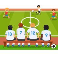 Children soccer team sitting on a bench N2
