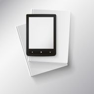 E-book lying on top of books