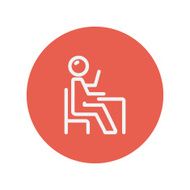 Student sitting on a chair in front of his table N6