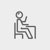 Student sitting on a chair in front of his table N7