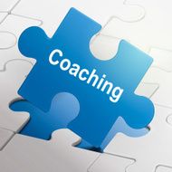 coaching word on blue puzzle pieces