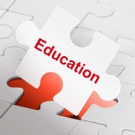 education word on white puzzle pieces