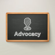 advocacy on blackboard in wooden frame