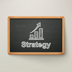 strategy on blackboard in wooden frame