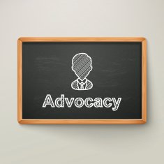 advocacy on blackboard in wooden frame
