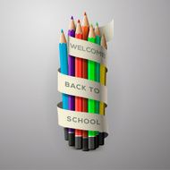 Colorful pencil crayons with text Back to school on ribbon