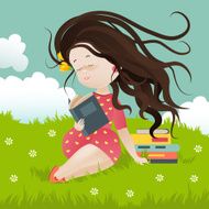 Girl sitting on grass reading a book