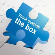 think outside the box on blue puzzle pieces