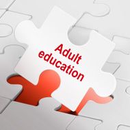 adult education on white puzzle pieces