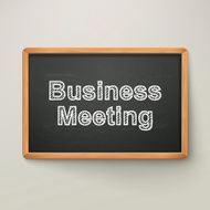 business meeting on blackboard in wooden frame