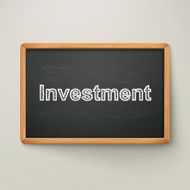 investment on blackboard in wooden frame