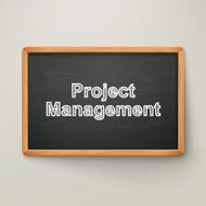 project management on blackboard in wooden frame