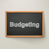 budgeting on blackboard in wooden frame